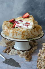 Pancake cake with cream cheese and strawberries