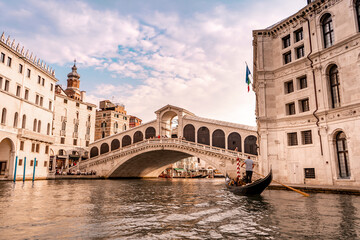 The beautiful Rialto bridge in the city of Venice in Italy seen from the boat.