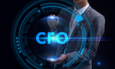 Business, Technology, Internet and network concept. Young businessman working on a virtual screen of the future and sees the inscription: CFO