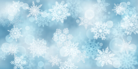 Fototapeta na wymiar Christmas background of blurry snowflakes in light blue colors