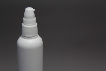 Plastic Spray Sanitizer Bottle On Gray Background.