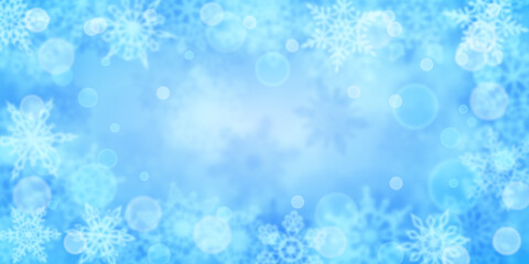 Naklejka na ściany i meble Christmas background of blurry snowflakes in light blue colors