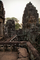 Fototapeta premium Stone murals and sculptures at Bayon Temple in daylight, Angkor Wat, Cambodia