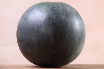 the seedless watermelon - melon cut in half on the wooden table