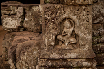Fototapeta na wymiar Stone murals and sculptures at Bayon Temple in daylight, Angkor Wat, Cambodia