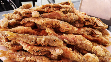 Deliciously fried red mullet fish on a plate
