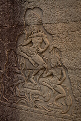 Fototapeta na wymiar Stone murals and sculptures at Bayon Temple in daylight, Angkor Wat, Cambodia