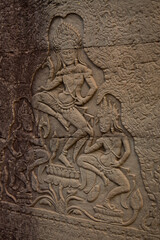 Stone murals and sculptures at Bayon Temple in daylight, Angkor Wat, Cambodia