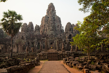 Stone murals and sculptures at Bayon Temple in daylight, Angkor Wat, Cambodia
