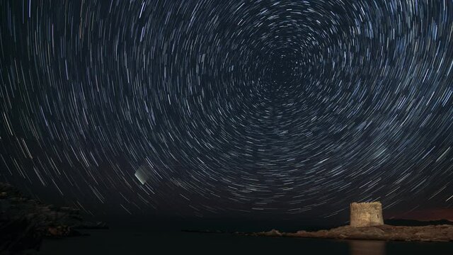 Time lapse startrails on the beach of La Pelosa, under the Medieval Tower. Stintino - Sassari - Sardinia