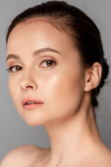 Obraz premium portrait of beautiful naked woman with perfect skin isolated on grey