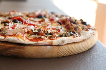 Delicious fresh pizza on table outdoors, closeup