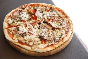 Delicious fresh pizza with olives on table outdoors