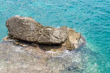 Rough sharp fallen rock near sea coast