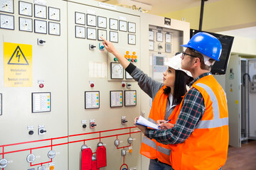Professional industrial engineers operating in electricity substation
