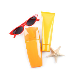 Sun protection products, sunglasses and starfish on white background, top view. Beach objects