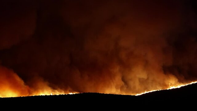 Wild Fire Burning on Ridge Line at Night Near Reno Nevada