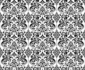 Wallpaper in the style of Baroque. Seamless vector background. White and black floral ornament. Graphic pattern for fabric, wallpaper, packaging. Ornate Damask flower ornament