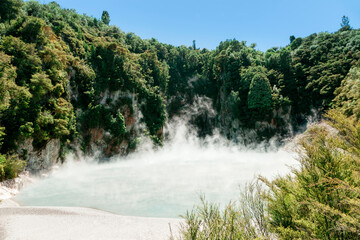 Inferno Crater Lake with rising steam in Waimangu Volcanic Valley