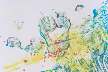 Human footprints with colored paint on a white background. Print of a female foot on paper. No people. Texture.