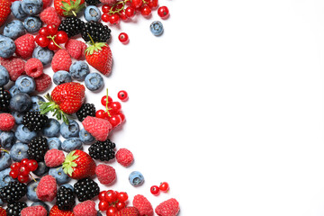 Mix of fresh berries on white background, flat lay