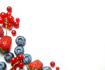 Mix of fresh berries on white background, flat lay