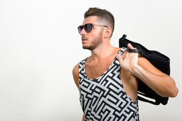 Portrait of handsome bearded Hispanic tourist man