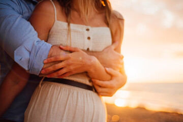 Young couple hugging in sunset
