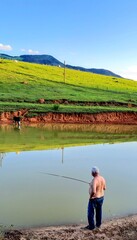Naklejka premium fisherman on the river