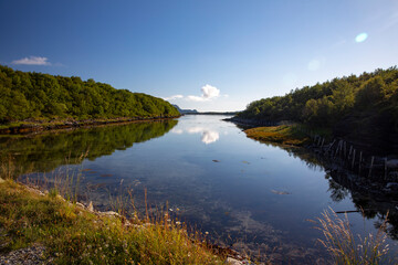 Naklejka premium Hiking on a trail along the sea side in Nordland county