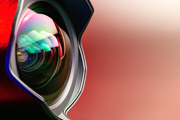 The camera lens with red  backlight. Close-up of the camera lens on a red  background. Optics..