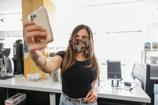 Young Woman Wearing Face Mask Takeing Selfie
