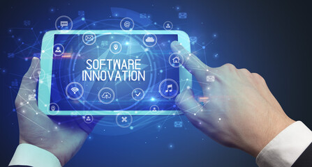 Close-up of a tablet with SOFTWARE INNOVATION inscription, innovative technology concept