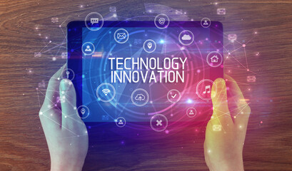 Close-up of a tablet with TECHNOLOGY INNOVATION inscription, innovative technology concept