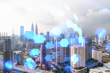 Fototapeta na wymiar Abstract technology icons hologram over panorama city view of Kuala Lumpur, Malaysia, Asia. The concept of people networking and connections. Double exposure.