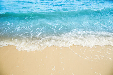 Fototapeta na wymiar Sea waves rolling on beautiful sandy beach. Summer vacation