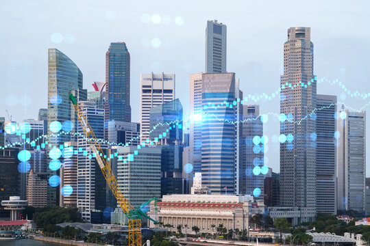 Forex and stock market chart hologram over panorama city view of Singapore, the financial center in Asia. The concept of international trading. Double exposure.