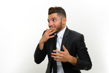 Portrait of handsome bearded Hispanic businessman in suit