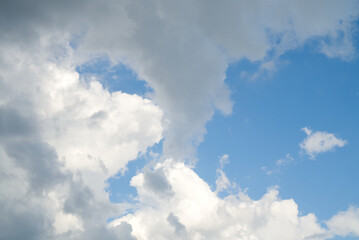 Obraz premium cloudscape in blue sky, white and dark clouds