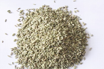 Brown cumin seeds healthy medicinal grains heaped up in white background..