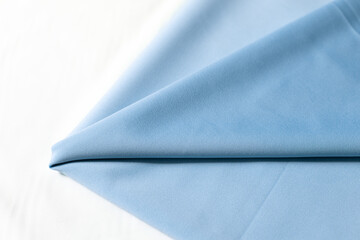 Knitwear, blue fabric. fabric for clothing. fabric on a white background