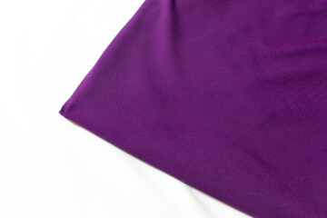 The knit fabric purple color. fabric for clothing. fabric on a white background