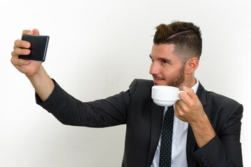 Portrait of handsome bearded Hispanic businessman in suit