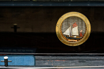 model sailboat through a porthole in Dunkirk, france