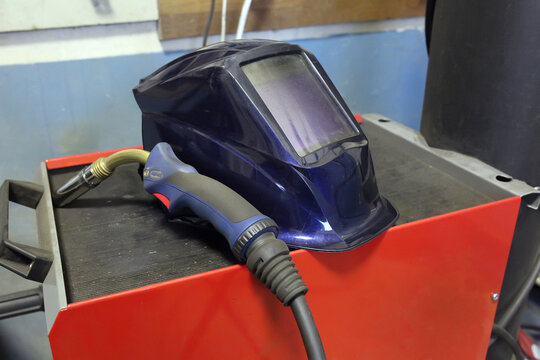 Tools for welding. Welders protective mask, electrode lies