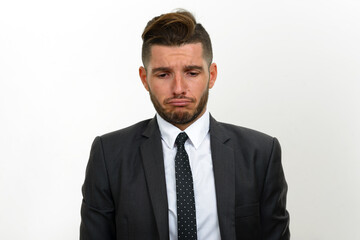 Portrait of handsome bearded Hispanic businessman in suit