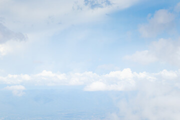 Beautiful blue sky with white fluffy clouds.