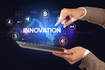 Close-up of a touchscreen with INNOVATION inscription, business opportunity concept