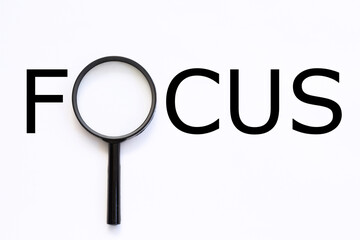 FOCUS Word with Magnifying Glass on white background