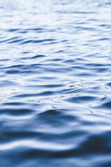 Naklejka premium Abstract dark deep blue water sea for background. close up, low angle view. ocean waves